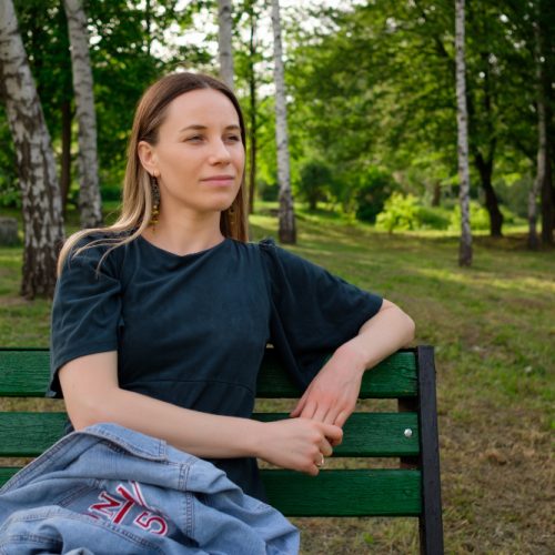 young-woman-relaxing-park-sitting-chair